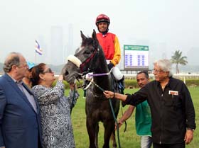 Trainer Bezan Chenoy Mrs Bakhtawar B Chenoy and D R Thacker leading in Agatha (A Omkar up), winner of R R Komandur Plate at Mumbai on Sunday.