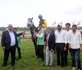 R Rego and trainer Pradeep Chouhan leading in Ardakan (Sandesh up), winner of Moosa M Hoosein Trophy at Pune on Sunday.