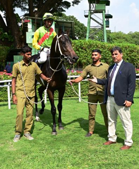 Christofle (Trevor Patel up) winner of the V.T. Velu Memorial Trophy, being led in by trainer P Shroff on Sunday racecs at Bangalore.