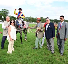 Dyf (Yash Narredu up) winner of the ZAVARAY POONAWALLA STAYERS` CUP (GR.1), being led in by trainer Adhirajsingh Jodha on Saturday races at Mysore.