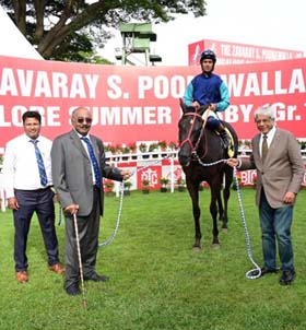 Emphatic (Trevor Patel up), winner of Chennai Cup being led in by trainer Padmanabhan and D R Thacker at Bangalore on Saturday.