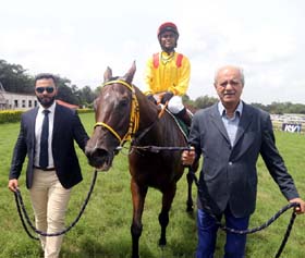 Trainer Shazaan Shah and Jayadev Mody leading in Esperanza (Adiya Waydande up), winner of Bushtops Plate at Pune on Sunday.