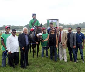 Former trainer and horse owner S S Shah leading in Between Friends (Prashant Dhebe up), winner of Azzurro Plate at Pune on Sunday along with trainer M K Jadhav.