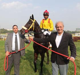 Trainer Bahram Cana and Jayadev Mody leading in Foxy (Sandesh up), winner of Panchshil Million at Pune on Saturday.