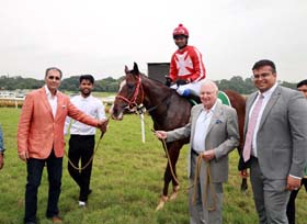 Trainer Dallas Todywalla and Zavaray Poonawalla leading in Giacomo (Sandesh up), winner of Free Press Journal Trophy at Pune on Saturday.