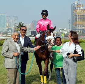 Trainer Imtiaz Sait, Milan Luthria, Liane Luthria leading in Endurance (Yash Narredu up), winner of Jayarasmdas Patel Gold Trophy at Mumbai on Sunday.