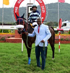 Trainer Joseph B Awale and jockey K Sai Kiran leading in Sea the son, winner of Governor`s Cup at Mysore on Friday.
