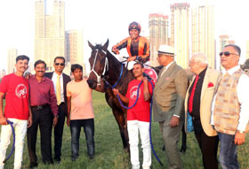 Excellent Lass (Suraj Naredu up), with the winning connections at Mumbai on Sunday.