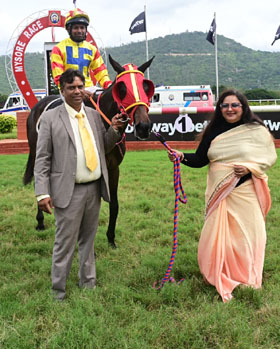 Meraki (S John up) winner of the ECLIPSE PLATE (DIV-I), being led in by trainer Rakesh on Thursday races at Mysore. 