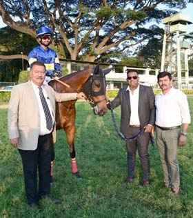 Trainer Pradeep Annaiah and Santosh G leading in Mister Brown (Arvind Kumar), winner of Malaprabha Plate at Bangalore on Sunday.