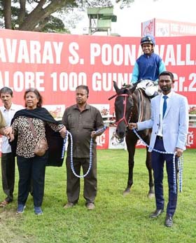 Sharmila Padmanabhan and trainer Purushotham leading in Emphatic (Neeraj Rawal up), winner of Hyderabad Silver Vase at Bangalore on Friday.