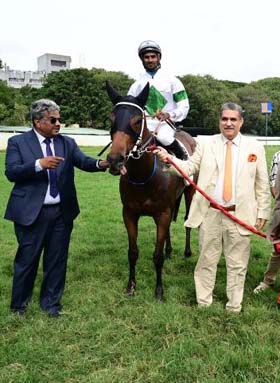 Trainer Prasanna Kumar and Capt Jamshed J Appoo leading in Starzela (Anthony Raj u p), winner of Bangalore Summer Million at the races held on Saturday at Bangalore.