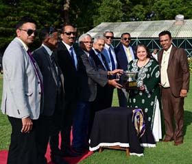 Mysore Race Club Steward H K Ramesh presenting the Chief Minister`s Trophy to Mrs Namrataa Rakesh and trainer Rakesh whose ward Yukikaze won this event at Mysore on Friday.
