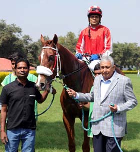 Trainer Imtiaz A Sait leading in Opus Dei (Umesh up), winner of Commander Trophy at Pune on Sunday.