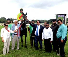 Mrs & Mrs Vijay B Shirke and trainer Pesi Shroff leading in Jade (Vivek G up), winner of Jaidev Trophy at Pune on Sunday.